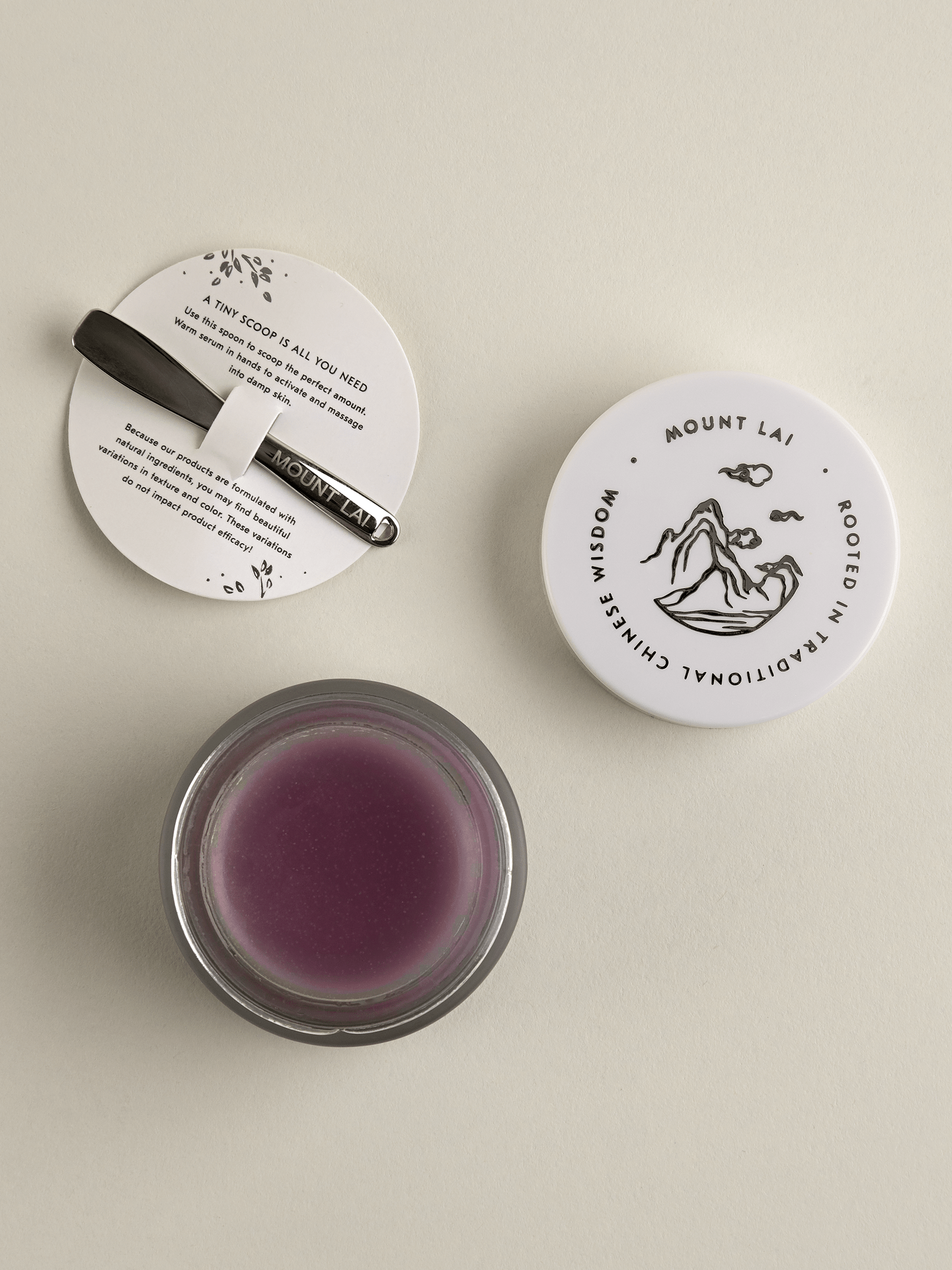 Top View of Calming Herbal Repair Serum Concentrate Balm and scooping spoon