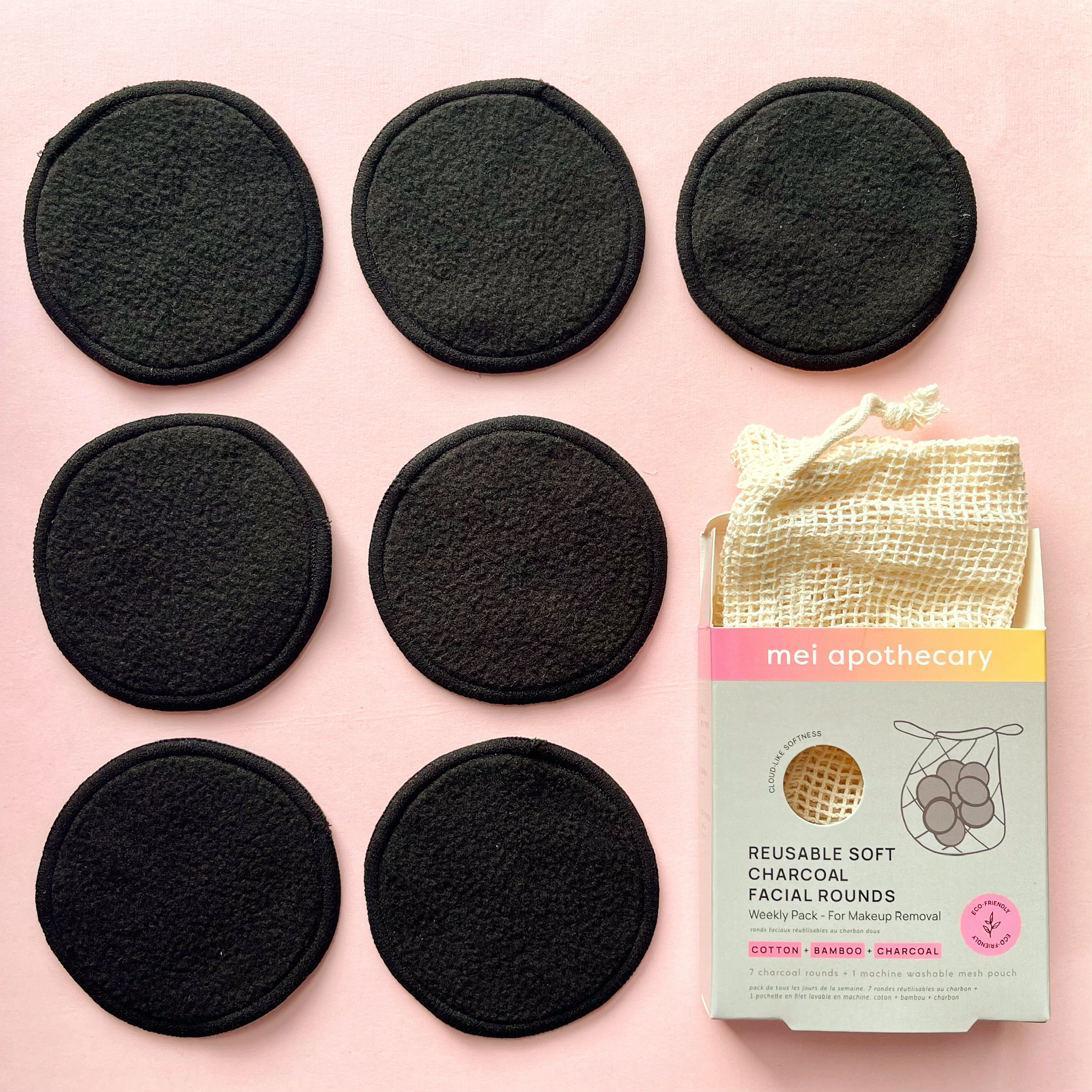 Flat lay of 6 Reusable Charcoal Soft Facial Rounds for makeup removal (with bag)