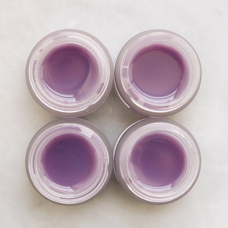 The Mount Lai Calming Herbal Repair Serum Concentrate Balm, a naturally purple balm that nourishes the skin.