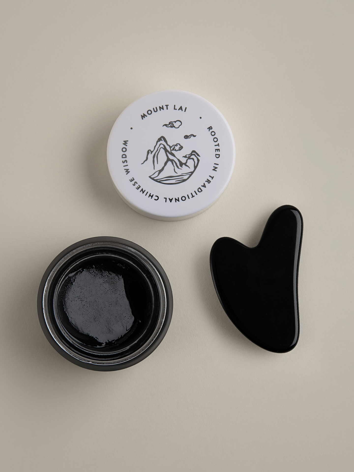 THERMAL RITUAL: Black Obsidian Gua Sha Lifting Tool + Warming Bamboo Charcoal Cleansing Balm