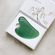 Firm, Lift, and Contour facial features with the Jade Gua Sha Facial Lifting Tool.