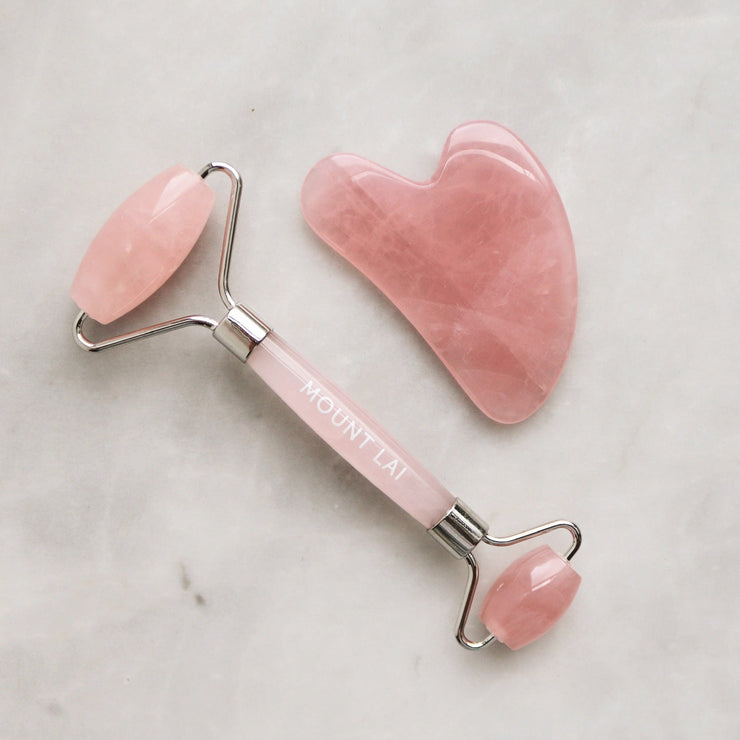 Mount Lai Rose Quartz Gua Sha Tool and Rose Quartz De-Puffing Facial Roller.