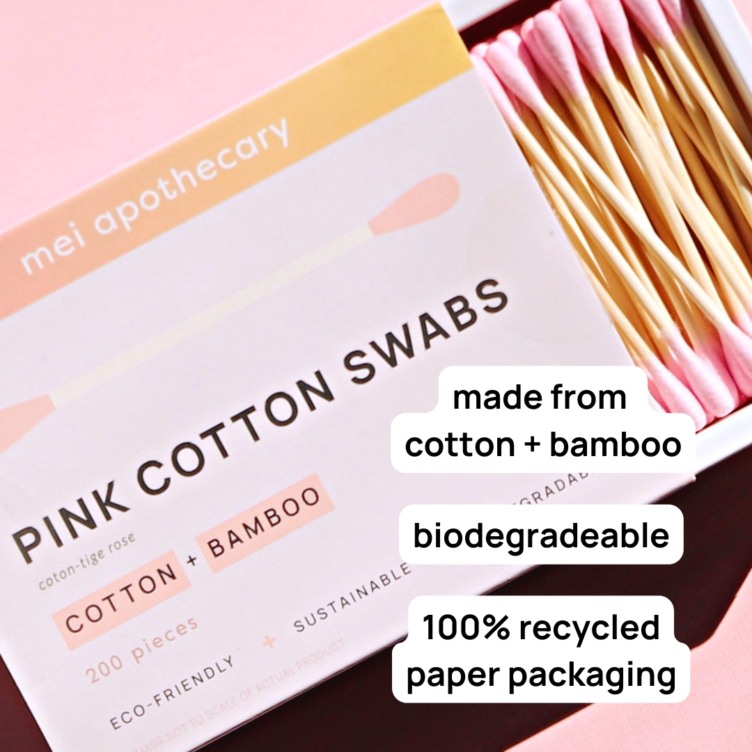 Pink cotton swabs in box featuring text that says biodegradeable, 100% recycled paper packaging and made from cotton & bamboo